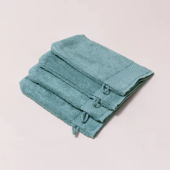 Luxe mineraalblauw Florence washandjes (4 stuks) van 100% GOTS-katoen, 600 g/m², hoge kwaliteit, zacht en absorberend.